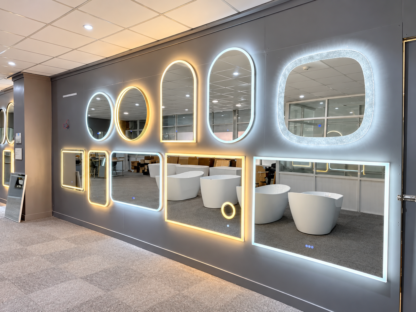 Bright modern bathroom mirror showroom displaying illuminated mirrors in different shapes and sizes